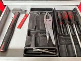 many tools in a tool box on the table