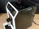 an image of a coffee machine on a wooden table