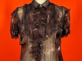 an image of a woman ' s shirt on a mannequin mannequin stand