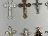 several different types of crosses are displayed on a white surface