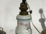 a lamp that is sitting on a table next to a lamp