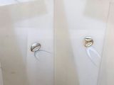 several pieces of jewelry are displayed on a table with a white cloth