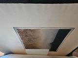 a open book sitting on a table with a window in it