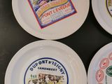four plates that have different types of beer on them