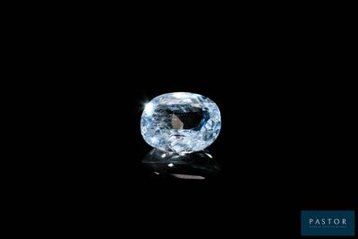 a blue diamond on a black background