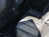 the back seats of a car with a seat belt in the back of it