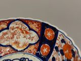 a bowl that has a blue and orange design on it