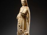 a statue of a woman holding a bird in her hands