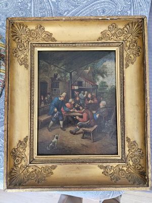 une photo d'un tableau représentant une famille en train de jouer aux cartes