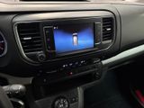 the dashboard of a car with a blue screen in the center of it