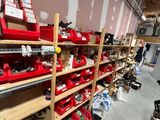 many shelves with tools on them in a garage