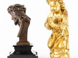 two statues of a child and a bust of a man