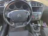 the interior of a car with a steering wheel and dashboard controls