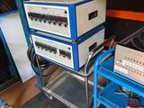 a blue cart that has a bunch of electronics on top of it