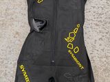 the bodysuit is black and has yellow writing on it