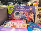 several children ' s science toys are on display in a store