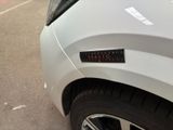 a sticker that says quality on the side of a car
