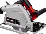 an image of a circular saw with a red handle