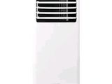a white air conditioner sitting on top of a white table