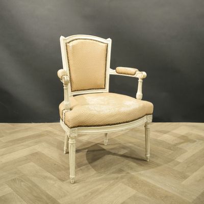 an image of a white chair with a beige upholstered seat