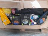 a cardboard box full of items that are sitting on the floor