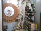 a machine that has a large roll of paper on it