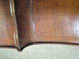 a close up of a violin that has been cleaned