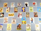 a lot of old movie posters on the table