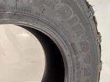 a close up of a tire that is on a white surface