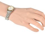 wrist shot of a woman ' s wrist with a watch on it