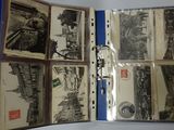 a lot of old books that are open on a table