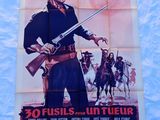 une vieille affiche de cinéma représentant un homme tenant un pistolet à la main