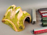 a lot of toy trains that are sitting on a table