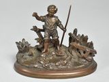 bronze figurine of a boy with a stick in a field