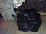 two speakers sitting on top of each other on the floor