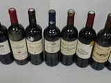 many bottles of wine lined up on a table