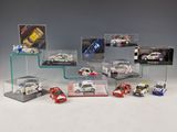 many different models of cars in a display case
