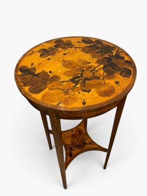 a round table with a floral design on the top