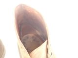 a close up of a pair of shoes that are dirty