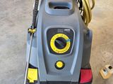 an image of a high pressure washer in a garage