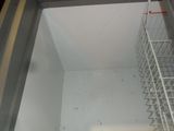 an image of the inside of a freezer with a lot of food inside of it