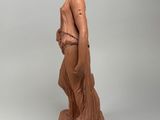 an image of a statue of a woman standing on a pedestal