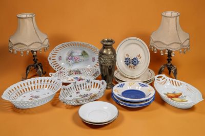 many different types of plates and bowls on the table
