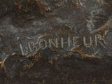 an image of a close up of a statue of a horse on a rock
