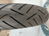 a close up view of a motorcycle tire on the ground