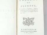 an open book with a picture of a coat of arms on it