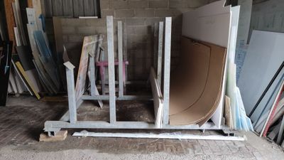a pile of construction materials sitting in a garage