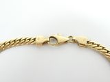 an image of a gold bracelet on a white background