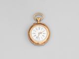 an antique gold pocket watch with roman numerals on the dial
