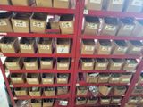 many boxes of assorted items on the shelves